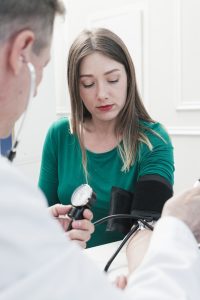 Doctor checking Blood Pressure